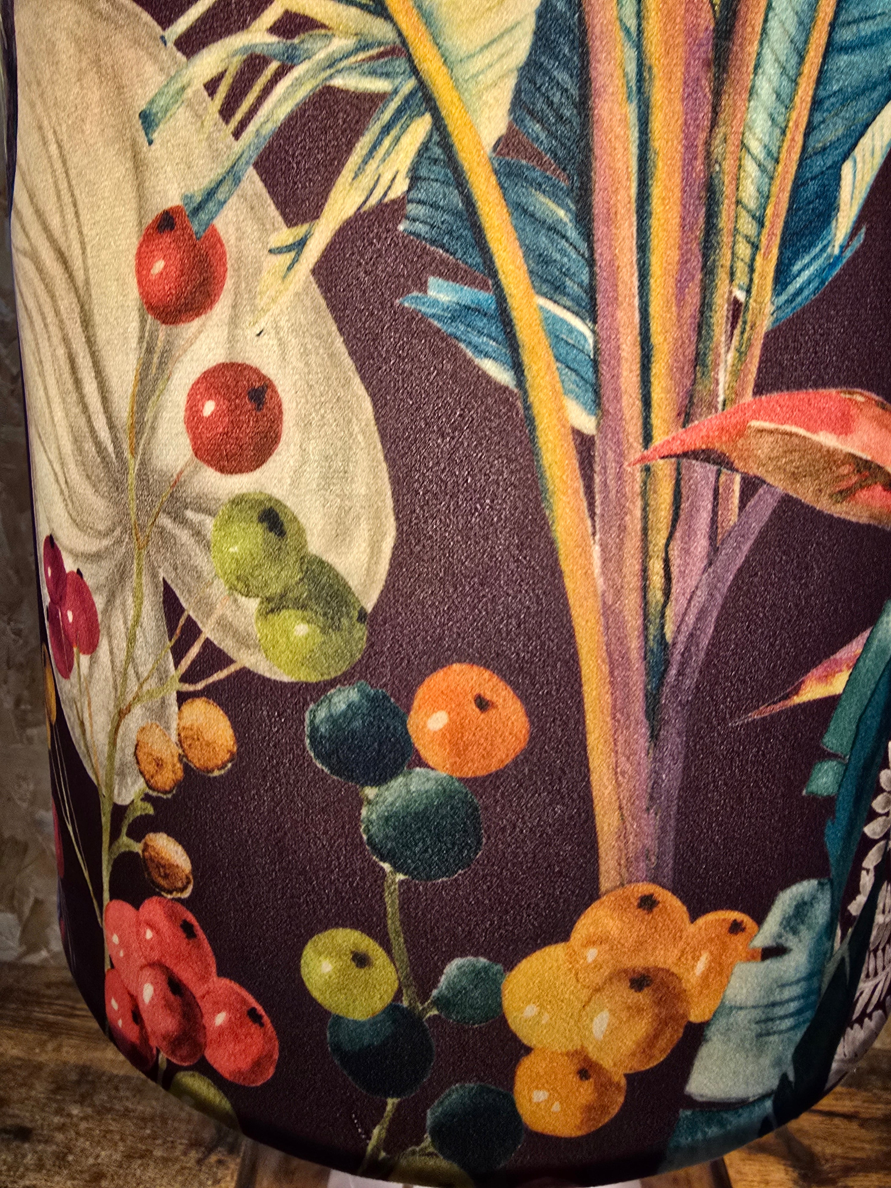 plush purple velvet fabric with bold botanical print and berries