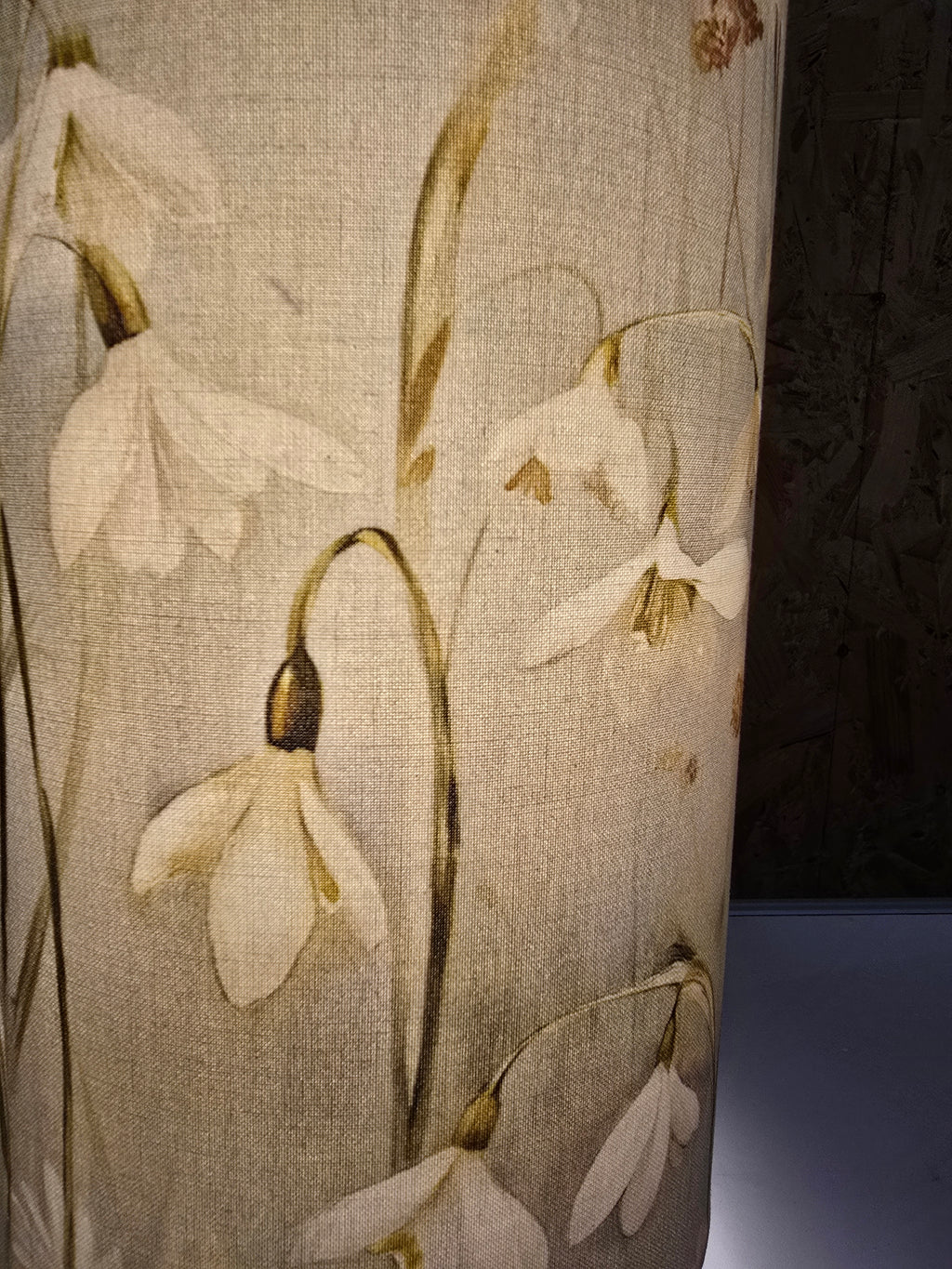 handmade cylindrical plug in lamp with tripod base and bayonet bulb.  cotton snowdrop fabric in pale green and blue table lamp with switch.  handmade lighting in made in UK. 15cm wide and 35cm tall table lamp for bedside table and cosy mood lighting.